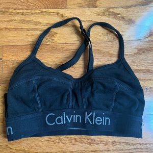 Calvin Klein size small black womans sports bra with adjustable straps.